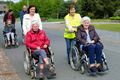 Rolstoelgebruikers Corsala maken kleine bedevaart