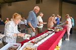 Taart en BBQ bij Okra Werkplaatsen
